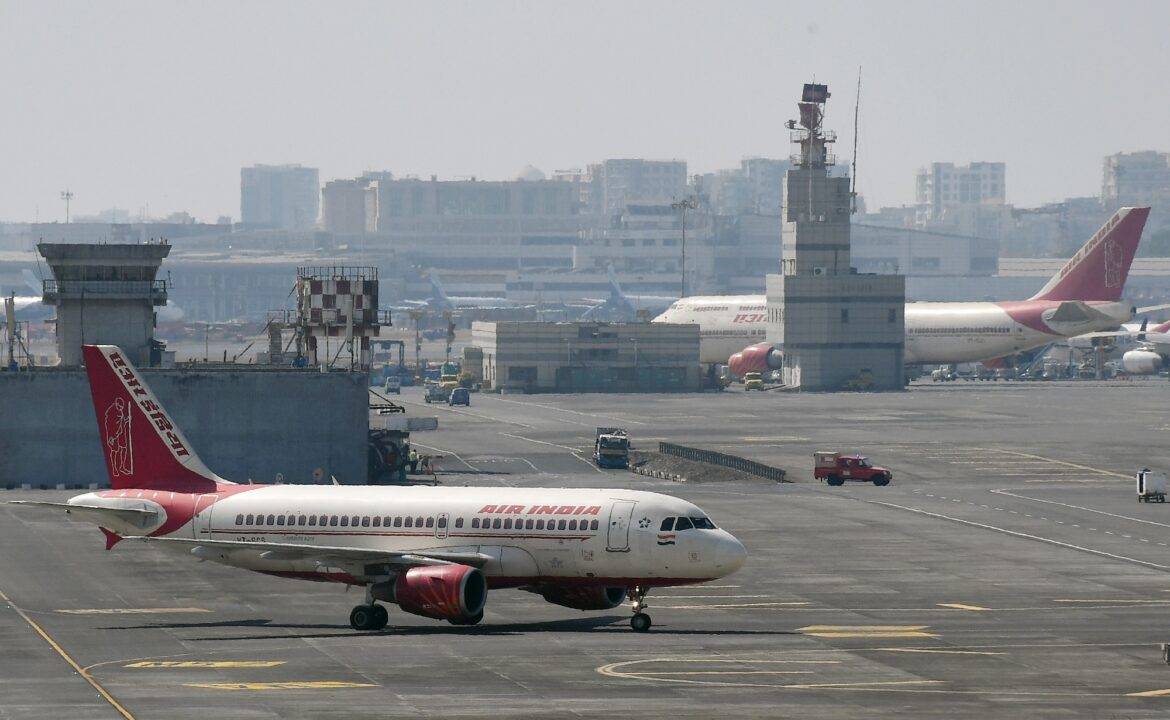 Air India aeroplanes are seen on the runway at the airport